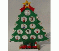 Christmas tree with red train of two carriages  in front