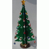 Christmas tree with small ornaments and a yellow star on top